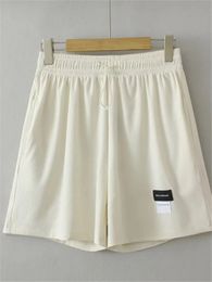 Vêtements pour femmes de taille plus short de taille élastique avec tissu tissé tissé en tissu lâche pantalon largement.