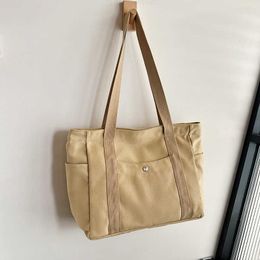 Sac à bandoulière en toile japonaise coréenne portable sac pour femme grande capacité multi-sac en tissu sac de loisirs travail sac fourre-tout de couleur unie 240315