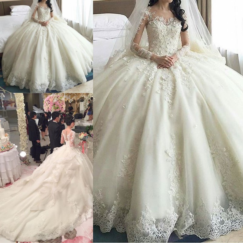 Prinsessan Lace Ball Gown Bröllopsklänning med Sheer Neck Illusion Långärmade Bröllopsklänningar Tillbaka Täckta Knappar Bridal Vestidos