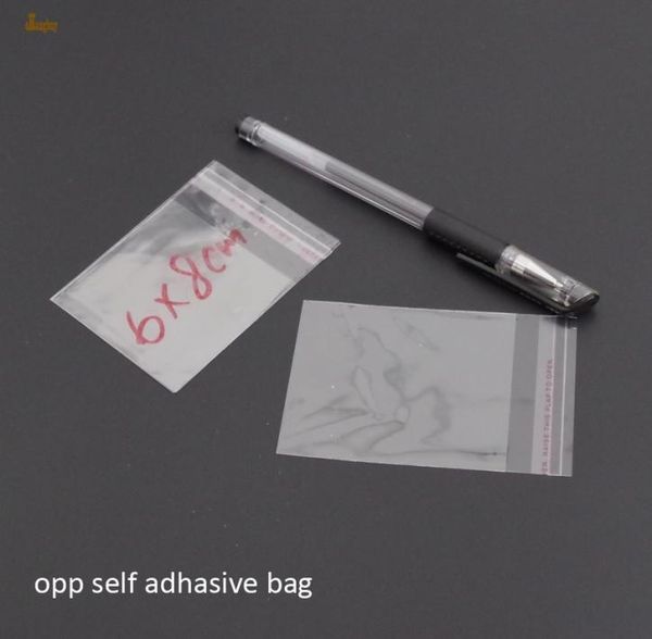 Promoción real 1000pcs transparente BOPP poli -celofán Bag 6x8cm Bolsas de regalo OPP transparentes Embalaje de plástico Auto adhesivo S8030257