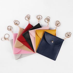 Porte-clés en cuir PU, anneaux, sac de rangement pour masque facial portable, porte-clés, porte-cartes à pression, masques réutilisables anti-poussière, conteneur pendentif, porte-monnaie