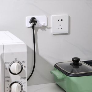 Punch-vrije plughanger socket haak woningdraadpluggen pluggen lijmhanger mobiele telefoon oplaad opslagrek opslag haken