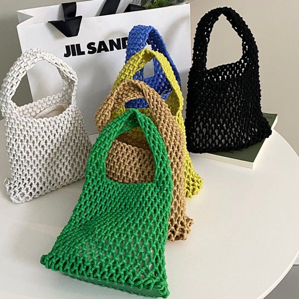 Qualité classique fait à la main portable tissé évidé sac à main mode tout match sac en maille avec doublure vide petit sac de plage