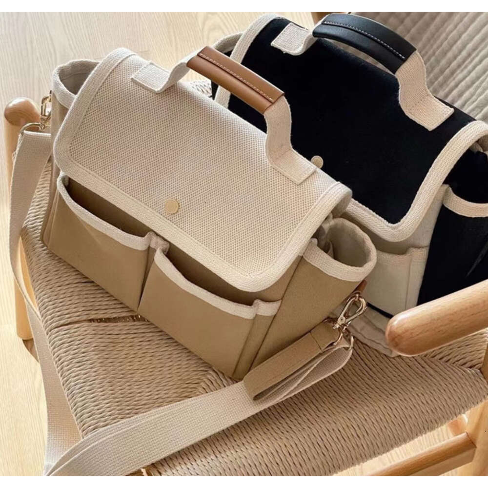 "Waterproof Diaper Bag for Mom - Stylish Canvas Maternity Bag with Stroller Organizer, Ideal for Mother and Baby Essentials"