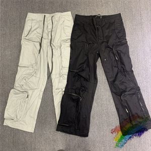 Real pic Multi bolsillo Cargo pantalones hombres mujeres Unisex moda Joggers cordón pantalones de chándal