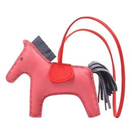 Chaînes en cuir véritable mini cheval coloré avec pompon poney porte-clés pour femmes porte-sac de charme pendentif ornement de voiture porte-clés 2021268e