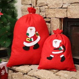 Sacs-cadeaux de Noël rouges Grand sac de bonbons Sac de Noël Sac de cordon de cordon de neige non tissé Sans sacs Santa Claus sacs pour enfants Pochette cadeau CFVT1155