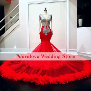 Rode luxe prom -jurken 2022 kralen lovertjes lovertjes kristal lange mouw veren backless sexy zeemeermin jurken afstudeer feestavondjurk