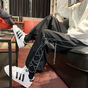 Pantalon de corde réfléchissant pour la marque de mode mince d'été pour hommes Instagram Instagram Hip Hop Workswear Loose High Street Casual Sports Pantal