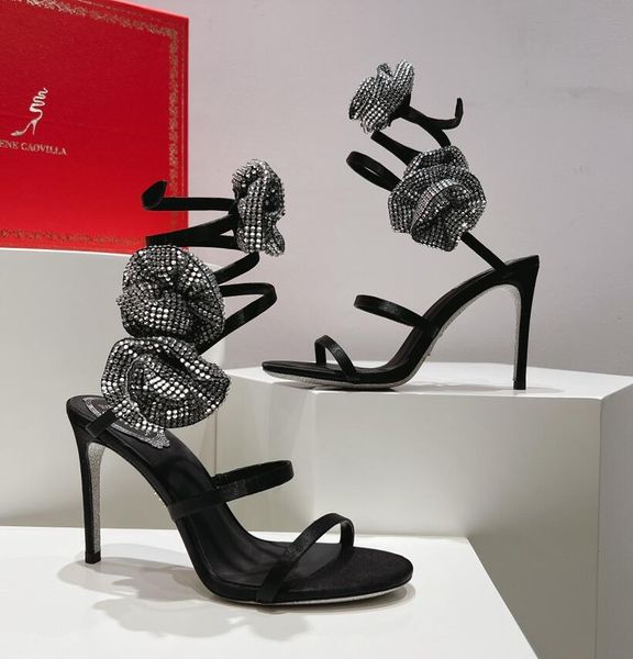 Rene Caovilla JUNIPER METALLIC SILVER SANDAL Zapatos de vestir de banquete de diseñador con tacones altos romanos envueltos en serpentina de diamantes de lujo estilo Hada para mujer