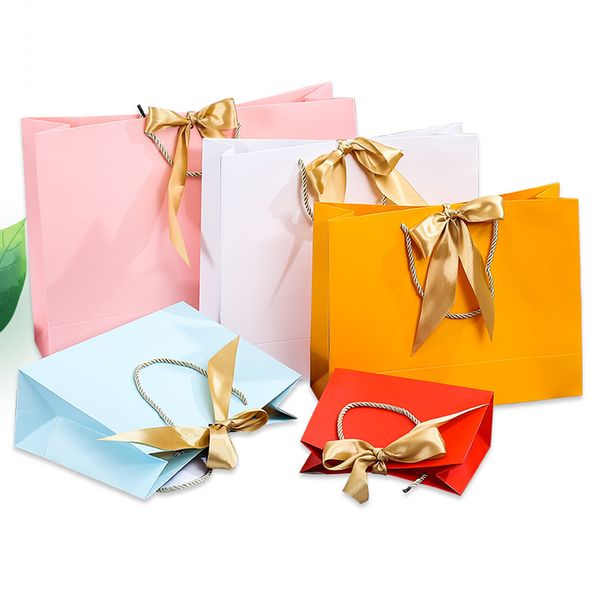 Vente au détail élégant logo de marque personnalisé sacs de luxe Boutique de vin petit shopping rose sacs-cadeaux en papier blanc avec poignées en ruban