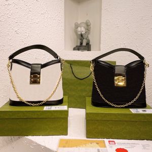 Bolso de hombro pequeño retro Diseñador Bolso de cuero grabado Cierre de cerradura Tachuelas dobles Lienzo Tote Hardware Cadena Cubo Bolsos de hombro Monedero