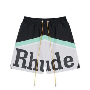 Rhude American Fashion gloednieuwe heren en dames contrasterende kleur patchwork -letter afdrukken losse casual gaas snel drogen shorts voor de zomer