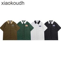 Ropa de diseñador Rhude High End para 2024 Meichao Nuevo stripe vertical de primavera/camisa de franja vertical con letra bordada camiseta de manga de manga corta con etiquetas originales 1: 1