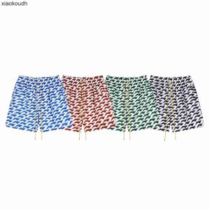 Rhude High End Designer Shorts pour 24s Fashion Trendy Micro Letter Geometry Block Couleur Shorts Unisexe High Street Beach Pantal