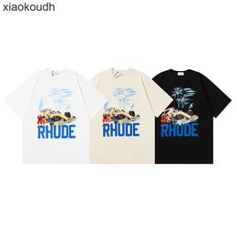 Rhude High End Designer T-shirts voor Meichao Coconut Racing Print High Street Oversize Mens en Dames Casual T-shirt T-shirtproef met korte mouwen met 1: 1 originele labels