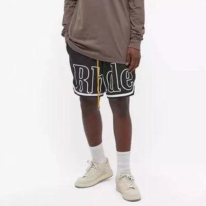 Rhude Mens Mesh Shorts Mode Hommes Femmes Casual Skateboard Réfléchissant Hip Hop Plage Poche Haute Qualité Bordure Blanche Court Asiatique Taille 33