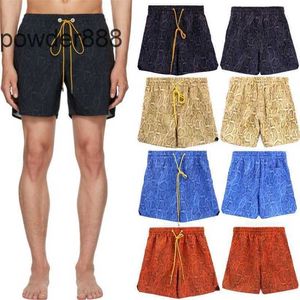 Rhude Python estampado pantalones cortos recortados de verano American High Street Casual Loose Flower Mens y mujer Pantalones de playa de malla