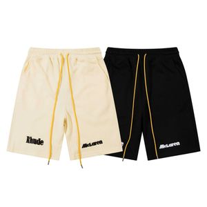 Rhude X McLaren Co Blanded Shorts Summer High Street Alphabet Bordado Bordado y Capris deportivos sueltos de mujer Capris