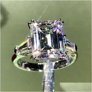 Anneaux Luxe Emerald Cut 4Ct Lab Diamond Bague 100 Original 925 Sterling Sier Bague de fiançailles pour femmes Bijoux de mariée Drop de Dh7Oj