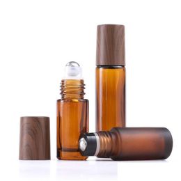 Roll On Bottles Wholesale 5Ml 10Ml 15Ml Amber Glass Roll-On Wood Grain Plastic Cap Frosted Essential Oil Per Bottle With Stainless Dro Dh1Zr