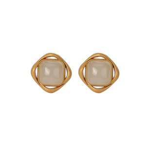 Pendientes de plata de ley S925 chapados en oro con jade natural Hetian, pendientes geométricos en espiral simples personalizados refinados para mujer