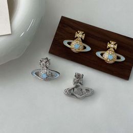 S925 Viviane Westwood Silver Saturn Empress Dowager Dowager Boucles d'oreilles bleues avec des diamants complets Tempérament doux Simple A