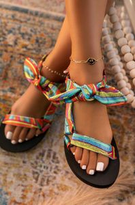 Sandalen nieuwe vrouwen bowknot zomer strand kleur plat veter boogschoenen voor dames mode outdoor luipaard open teen y2302