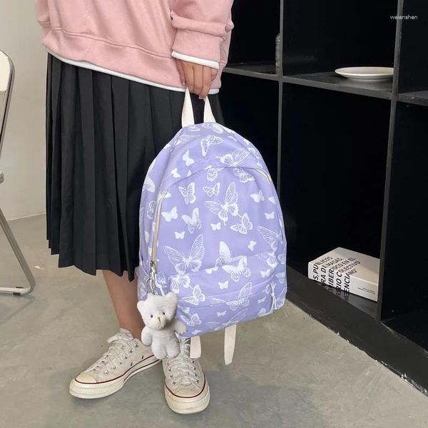 Bolsas escolares Patrón de mariposa de estilo coreano Mochila mochila Bolsa de nylon de niñas con colgante de muñecas Portable a corta distancia viaje