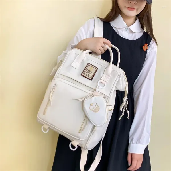 Bolsas escolares Mochila linda para estudiantes Ocio femenino Mochila escolar Versión coreana Simple Gran capacidad Nylon al por mayor