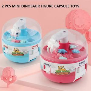 Science Discovery 2pcs Dinosaur Figuur Grabber Capsule speelgoed Mini Claw Hines Anti Stress Fidget Gift Prijs voor Kid volwassen Tiny Stuff 231007