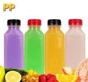 Bouteille de lait de bouteilles de jus en plastique transparent vide de Drinkware avec couvercle multicolore