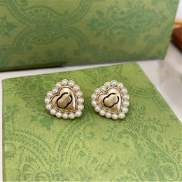Boucles d'oreilles femmes perle de rocaille charme classique d'amour de coeur avec bordure de corde lettre géométrie conception clou d'oreille