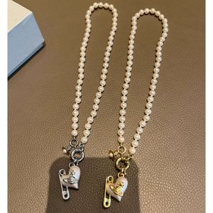 Seiko keizerin-weduwe liefdesspelden parelketting goud zilver zware aanraking kleine en populaire mode-sieraden