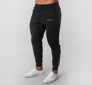 VENDRE MENS ALPHALETE JOGGER PAPANTS DE SOUTRAL MAN Gyms Workout Fitness Coton Cotton Male Mas Casual Fashion Skinny Track Pants3003169