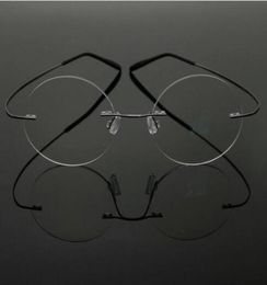 Venta de monturas de gafas de titanio con memoria ultraligera estilo estrella de Steve Jobs, gafas redondas sin montura para miopía, gafas ópticas Fra3833540