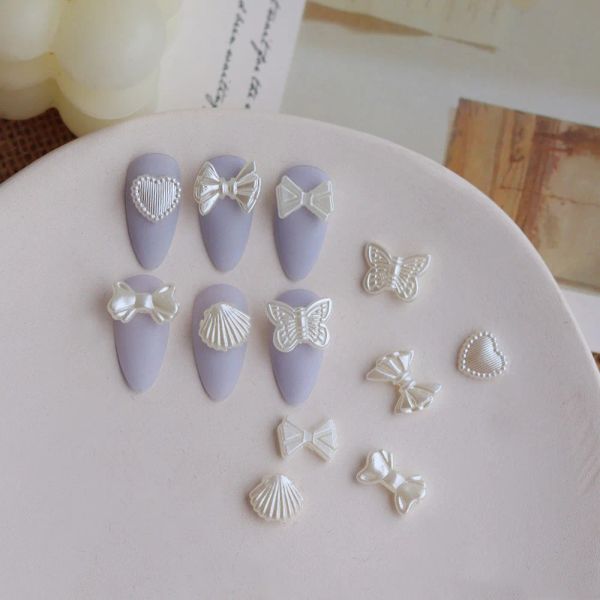 Sets 100pc mixpearl white nail art charme romanic baroque japon coeur bowknot parties accessoires de manucure de manucure de la coquille de papillon perlylustre