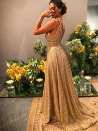 Sexy gouden A-lijn formele prom-jurk 2023 Mouwloze spaghetti-riem Backless Sequine Evening Gala feestjurken Robe de Soiree Customeded