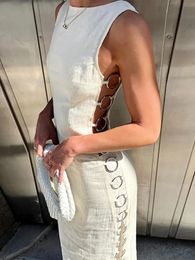 Sexy creux en fer anneau connecté robe femme élégante o cou sans manches maxi robes printemps chic femelle streetwear 240425