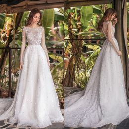 Abiti da sposa a maniche lunghe con cristalli di strass Abito da ballo senza schienale con perline importanti Abiti da sposa eleganti arabi Dubai