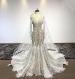 Sexy Voir à travers la robe de mariée en cristal en perles avec des plumes luxe Sparkly Plus taille Dubai Bridal Robe personnalisée MADE9894698