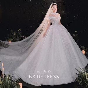 pure ronde hals sexy doorzichtige knoop terug lange mouwen appliques nieuwe vintage goedkope kanten trouwjurken vestios de novia glanzend kristal romantische bruidsjurk