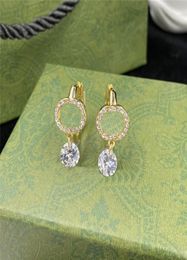 Glanzende heldere diamant hanger oorbellen charme in elkaar grijpende letters wortels dames elegante designer oorhoepels met box2726475