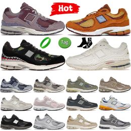 NIEUWE CASUAL Designer hardloopschoenen Men Dames 2002R sneakers Black Camo Camo Dusty Lilac Sandstone Trainers Heren Dames 2002r Outdoor Sports Trail Runner Shoe Runner Shoe