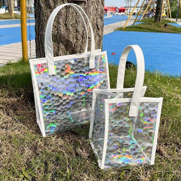 Bolsas de compras Bolsa de asas transparente con láser Bolso Estadio Regalo de plástico de PVC resistente al agua para niñas y mujeres Transparente