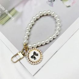 Corta de perla corta Pearl Fashion Rinestone colgante Pendiente Pelogante Pelogra móvil Lanyard Strap de muñeca de muñeca Back Case Anti-Prass Lanyard