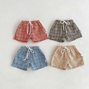 Shorts 2024 Été Baby Boys Shorts 0-3 ans NOUVELLES FILLES ÉLASTIQUES ÉLASTIQUE POCKET FLAT Bottom Coréen Style Baby Clothing D240510