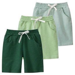 Shorts 2024 Été Nouveau Couleur solide Sports shorts adaptés aux vêtements pour enfants Vates élastiques Shorts Coton Coton Clothingl2405