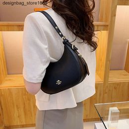 Designer des sacs d'épaule American Style Classic New Fashion Trend Underar Ungrand Bag des femmes Single Body Stick