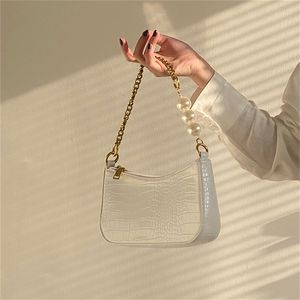 Bolsa de hombro Diseñador Mujeres Caimator Francés Baguette PU Bolsos de cuero Elegante Oficina Señoras Lujo Subarbrag Cadena Bolsa Pearls LVS Monederos